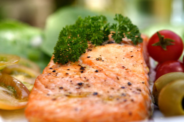 a photo of seasoned salmon dinner on a plate