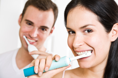 Couple brushing teeth in the bathroom