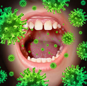 open mouth with enlarged computer generated bacteria flying around