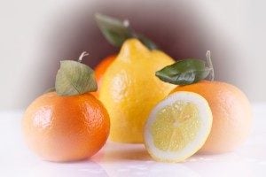 lemons and oranges on a table