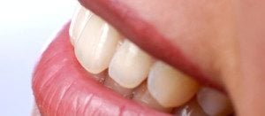 closeup of smiling woman's mouth and teeth