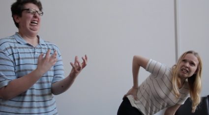 improv team members performing a scene