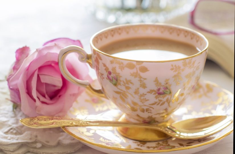 Hot tea in porcelain jug. stock image. Image of golden 