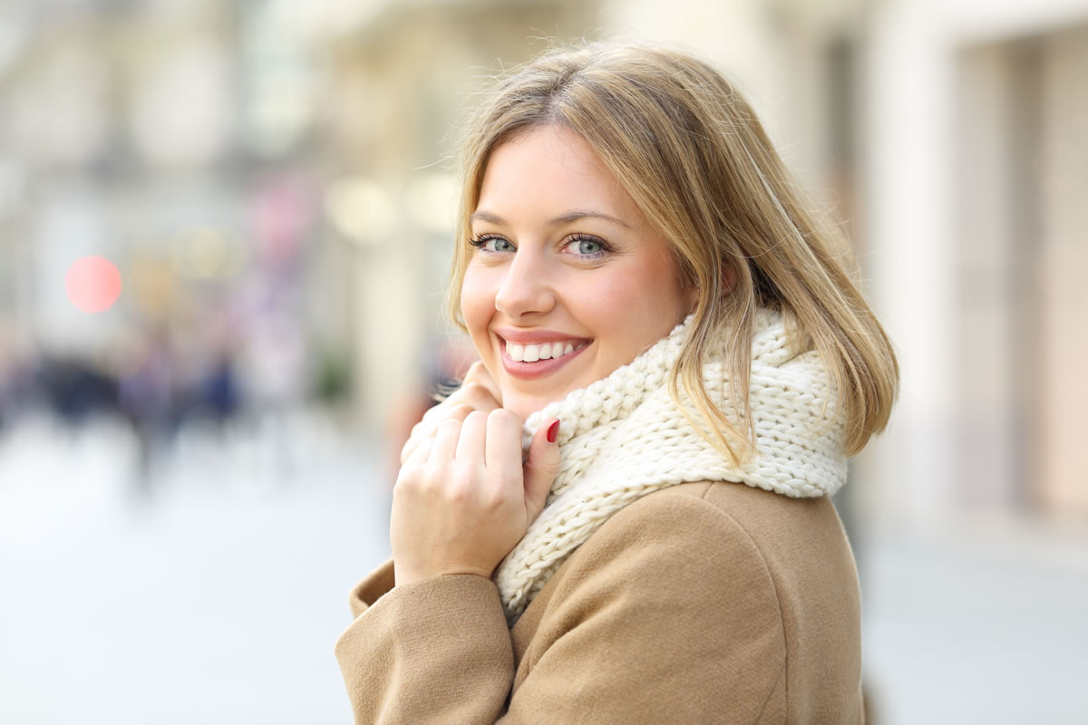 Smiling can help you beat the winter blues.