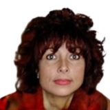 A person with curly brown hair and a focused expression, wearing a red top, against a white background.