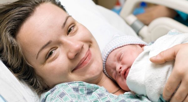 Happy mother with newborn baby